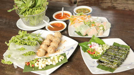 Food wrapped in leaves,A nutritious snack and Fresh Handmade Vegetable Spring Rolls in Thailand の写真素材