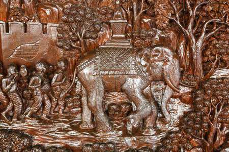 An ancient mural wood carving in Phra That Doi Suthep at Chiangmai Thailand の写真素材