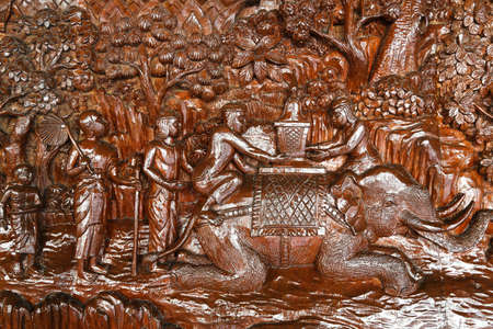 An ancient mural wood carving in Phra That Doi Suthep at Chiangmai Thailandの写真素材