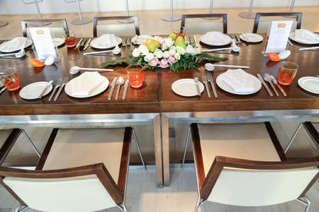 catering table set service with silverware, napkin and glassware at hotel の写真素材