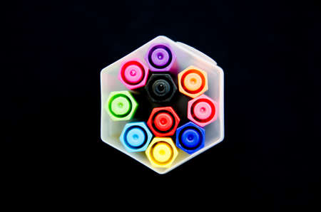 Colorful pens on a black backgroundの写真素材