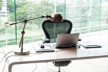 Notebook on a desk at modern officeの写真素材