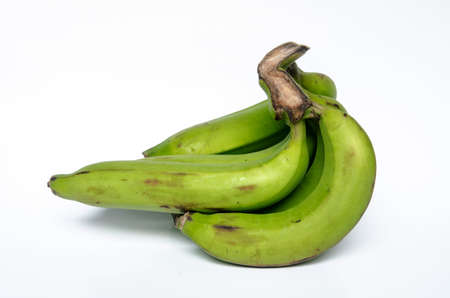 bunch of green bananas on white backgroundの写真素材