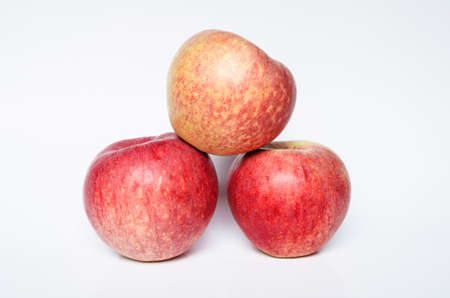 three apple fruit closeup isolated on white backgroundの写真素材