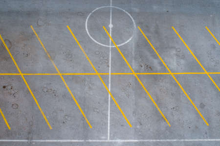 Empty parking lot with yellow linesの写真素材
