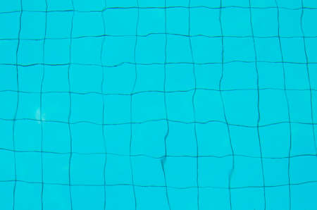 The Sun reflected in the water of the swimming poolの写真素材