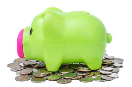 Piggy bank on coins backgroundの写真素材