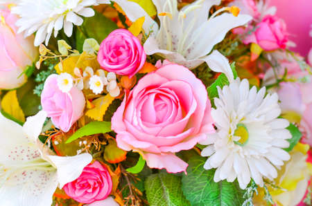 Floral background  Lot of artificial flowers in colorful compositionの写真素材