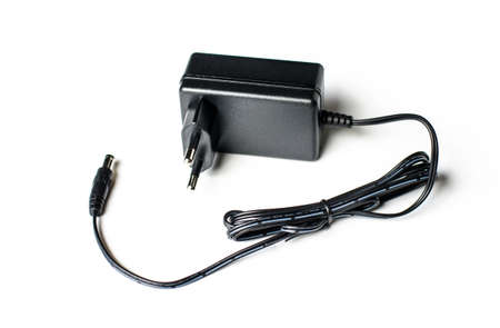 Black power ac to dc adaptor in white background