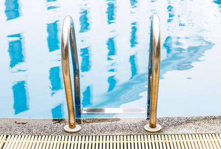 swimming pool ladder in hotelの写真素材