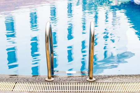 swimming pool ladder in hotelの写真素材