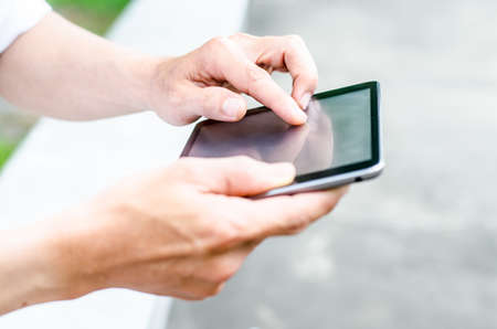 Man using tablet computer in the stadium