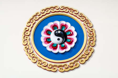 Yin Yang symbol wall in Chinese templeの写真素材