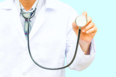 Doctor with a stethoscope in the hands and isolated on blue background