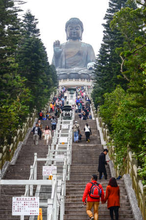 HONG KONG - February 06, 2015 : Tian Tan Giant Buddha from Po Lin Monastery, Lantau Island in Hong Kong on February 06, 2015 . It is a major centre of Buddhism in Hong Kong, and is also a popular tourist attractionのeditorial素材