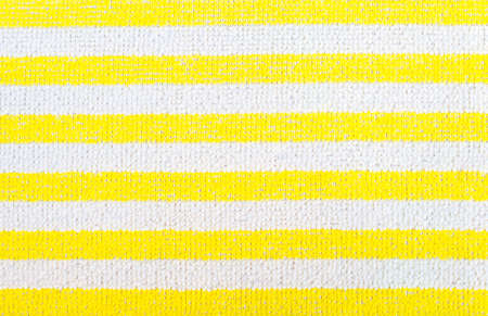 Yellow fabric striped texture. Clothes background. Close upの写真素材
