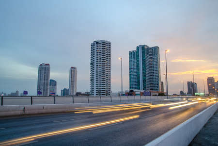 The light trails on the modern building background traffic jam on the highway,focus buildingの写真素材
