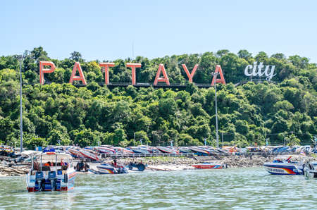 PATTAYA, THAILAND - JUNE 10: Coast of the Pattaya beach and boat on June 10, 2015 in Pattaya, Thailand. Billboard "PATTAYA CITY" in coastのeditorial素材