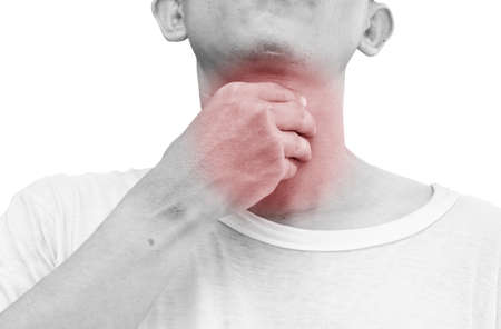 Unrecognizable man holds his throat, sore throat shown red, keep handed, isolated on white backgroundの写真素材