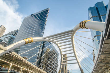 BANGKOK -Nov 7: View of high buildings and public sky walk for transit between Sky Transit and Bus Rapid Transit Systems at Sathorn-Narathiwas junction at evening on Nov 7, 2015 in Thailand.のeditorial素材