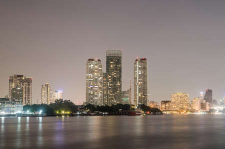 Bangkok city condo downtown at sunset with reflection of skyline, Bangkok,Thailandの写真素材