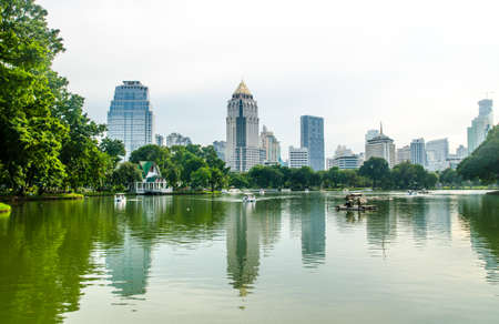 BANGKOK - Nov 7: Lake view of Lumpini Park in the Thai capital's city centre on july 7, 2015 in Bangkok, Thailand. Lumpini Park covers 142 acres with 2.5 km of pathways and a large boating lake.のeditorial素材
