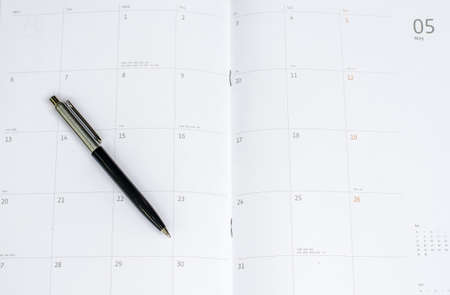 Daily planner with penの写真素材