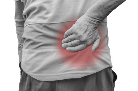 Senior man with back pain, isolated in whiteの写真素材
