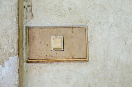 A closeup in a old light switch
