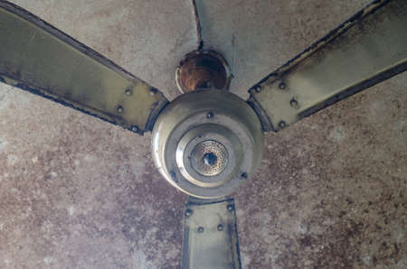 Dirty ceiling fan in the houseの写真素材