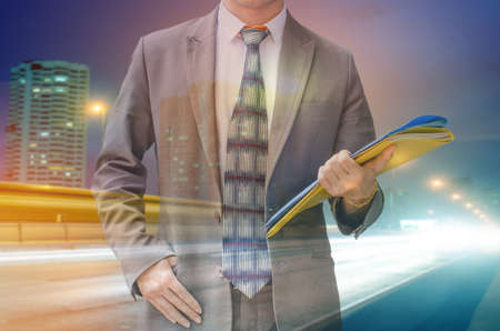 businessman holding important documents file  on white backgroundの写真素材