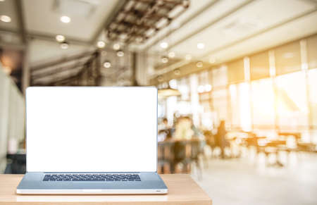 Side view laptop on desk work in coffee shop