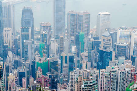 Hong Kong, China - 7 DECEMBER 2016: Hong Kong the scenes, victoria harbour from the peak bird view, in the mist with bad weather in the morning, nimbus landscape on the trailsのeditorial素材