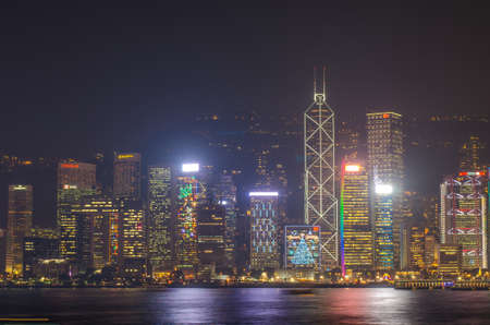 HONG KONG, CHINA - DEC 8, 2016: Hong Kong cityscape waterfront over Victoria harbor, to night on December 8, 2016 in Hong Kong, Chinaのeditorial素材