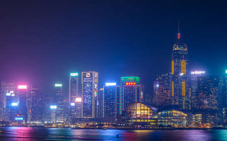 HONG KONG, CHINA - DEC 8, 2016: Hong Kong cityscape waterfront over Victoria harbor, to night on December 8, 2016 in Hong Kong, Chinaのeditorial素材