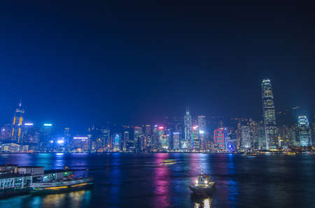 HONG KONG, CHINA - DEC 8, 2016: Hong Kong cityscape waterfront over Victoria harbor, to night on December 8, 2016 in Hong Kong, Chinaのeditorial素材