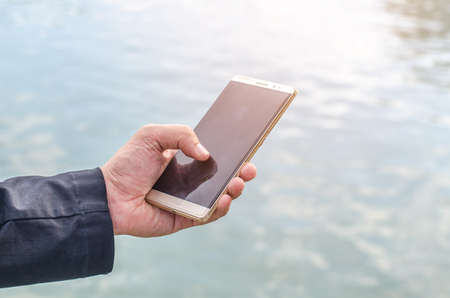 The close up a man using mobile smart phone.の写真素材