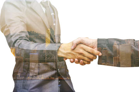 Double exposure of two businessmen shaking hands against white backgroundの写真素材