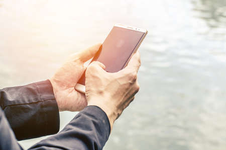 The close up a man using mobile smart phone.の写真素材