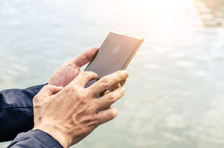 The close up a man using mobile smart phone.の写真素材