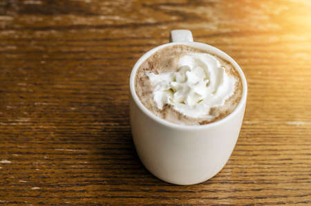 Coffee cup on table in coffee shop - vintage style effect pictureの写真素材