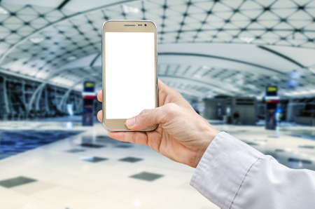 Man using smart phone mobile in the airport terminal