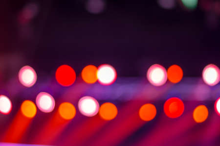 Defocused entertainment concert lighting on stage, blurred disco party.の写真素材