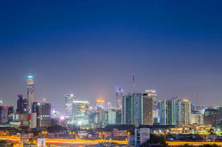BANGKOK - June 20,2017 : a view over the big asian city of Bangkok , Thailand at night time when the tall skyscrapers are illuminated and street traffic on june 20,2017のeditorial素材