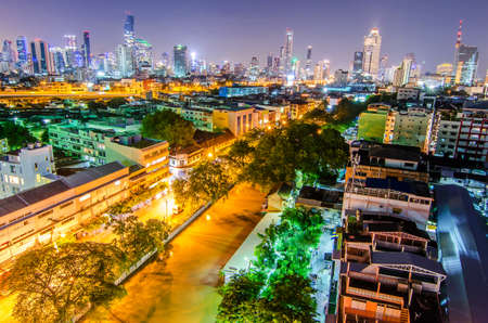 BANGKOK - June 20,2017 : a view over the big asian city of Bangkok , Thailand at night time when the tall skyscrapers are illuminated and street traffic on june 20,2017のeditorial素材