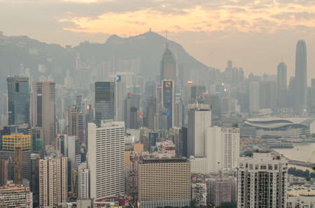 HONG KONG, CHINA - DECEMBER 10, 2016:  Skyscrapers and other buildings on Hong Kong Island in Hong Kong, China, viewed from the Braemar Hill on a foggy and cloudy evening.のeditorial素材