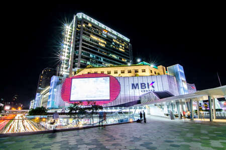 Bangkok,Thailand - 2 November 2017 : Night light with long speed shutter of traffic at MBK, BTS Siam interchange in front of Siam Discovery and Art Museum junction.This place is very famous shopping mall at central of Bangkokのeditorial素材