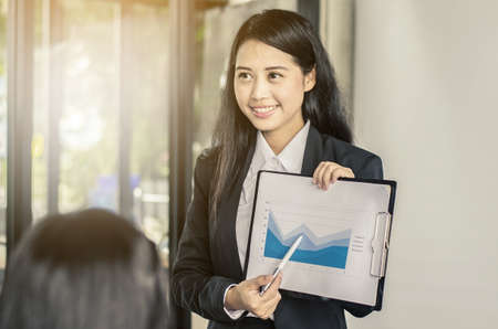 business women conference presentation with team training flipchart officeの写真素材