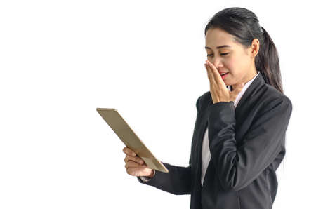 Asian beauty business woman in formal suit holding taplet communicating on white backgroundの写真素材