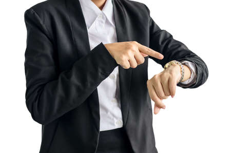 young business woman checks time on her wrist watch, time, late concept,  isolated on white backgroundの写真素材